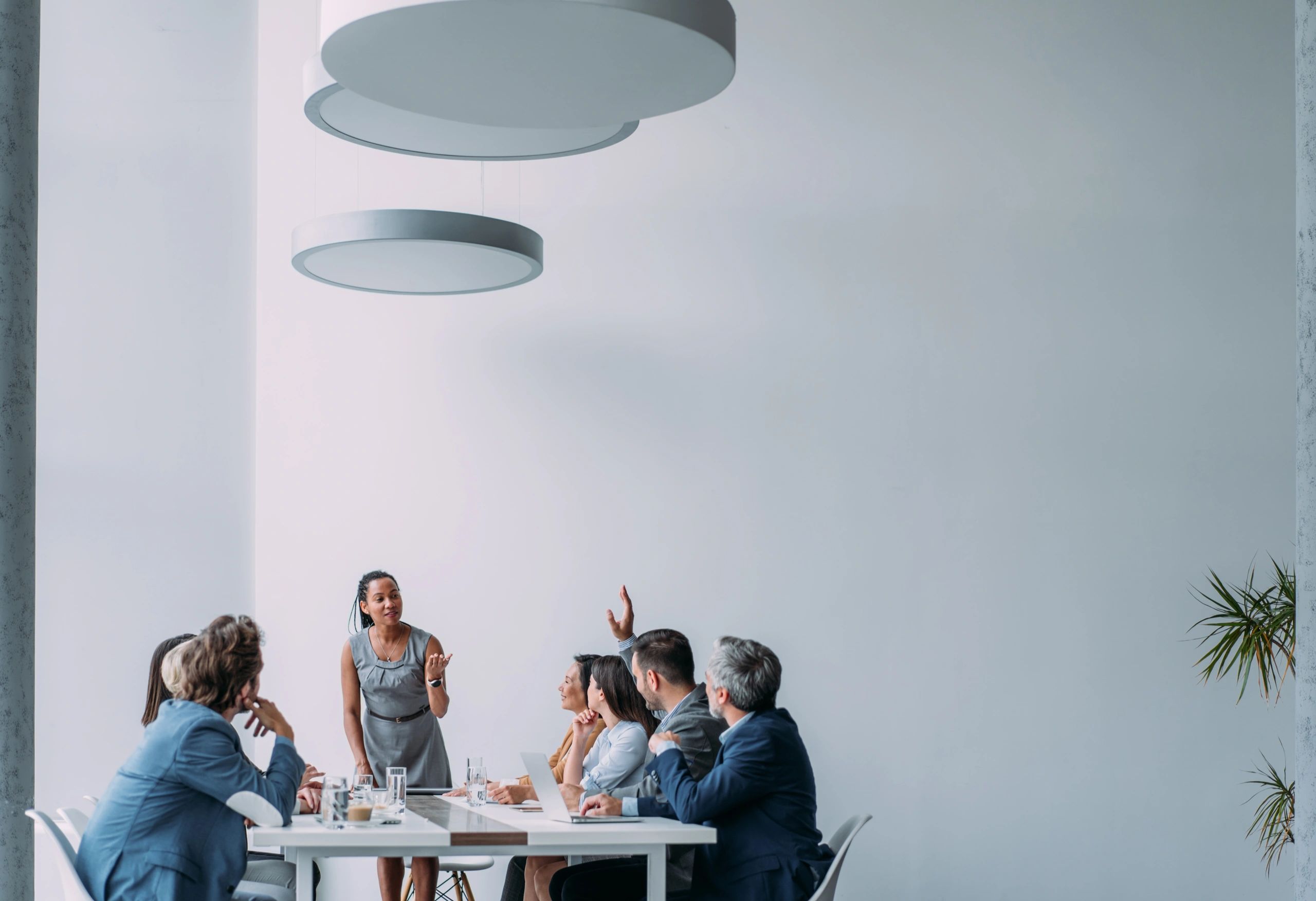 Businesswoman presenting to a team in a board room