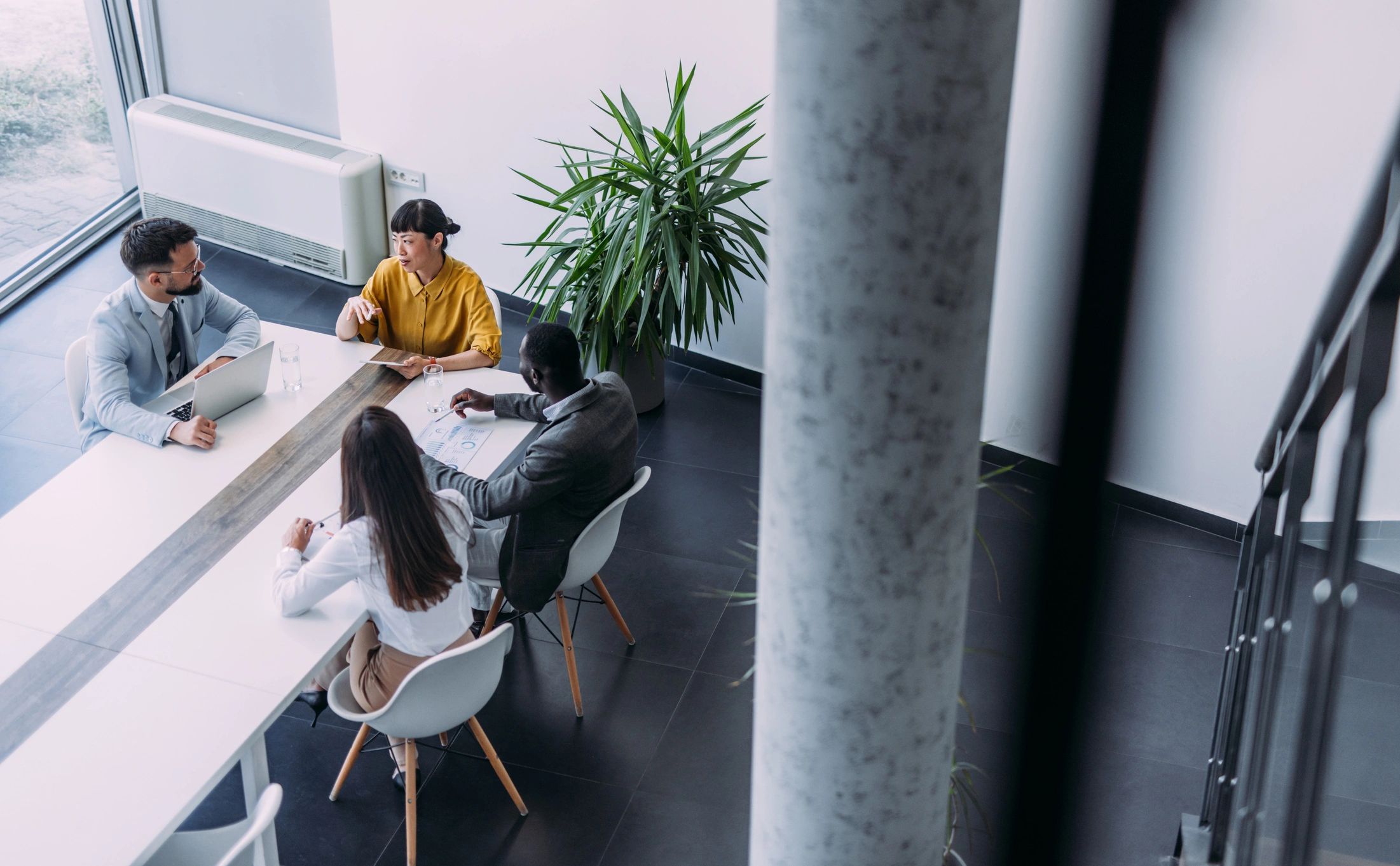 Business team gathered around a meeting table